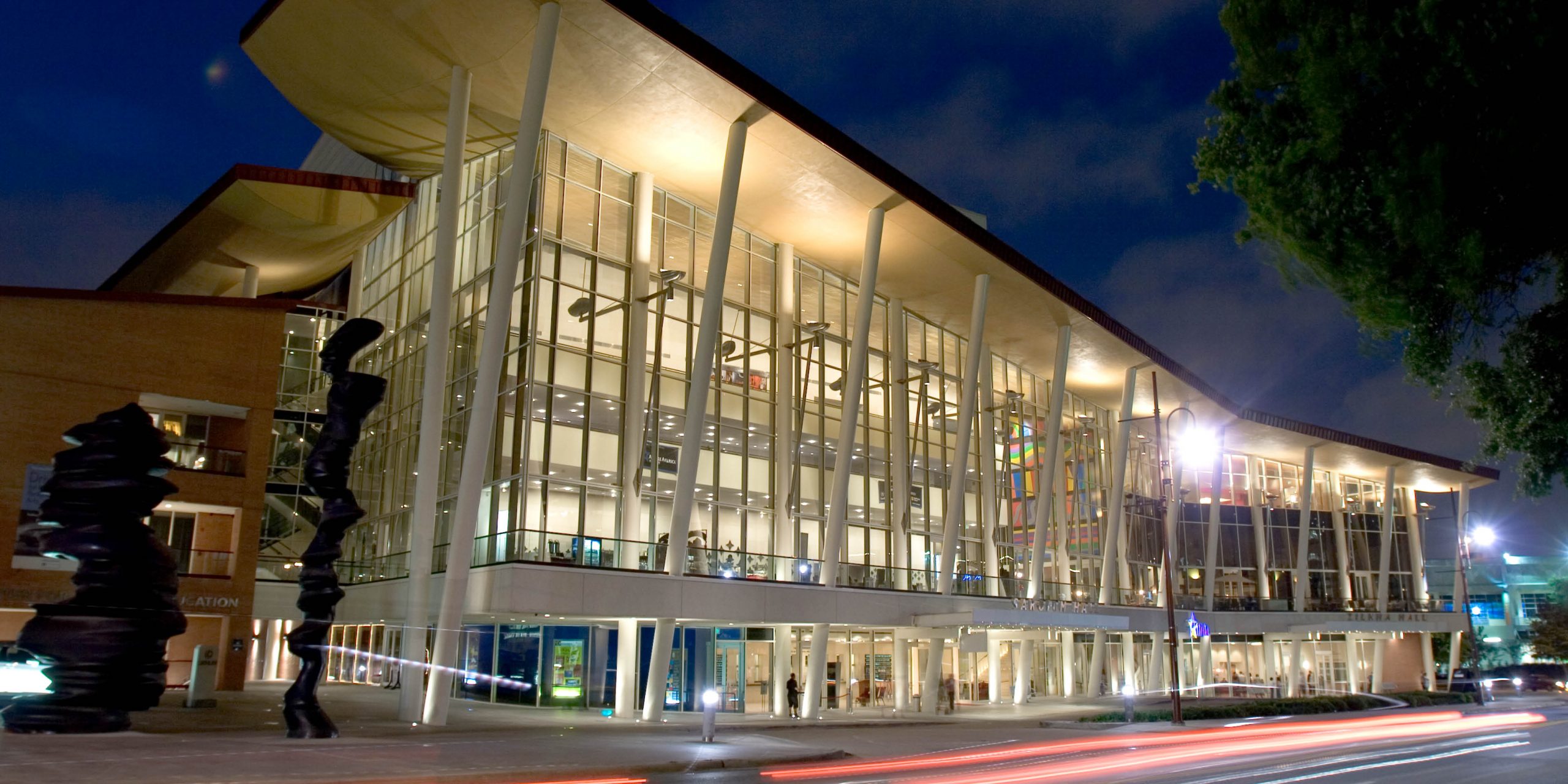 Exterior view of the Hobby Center for the Performing Arts at night.